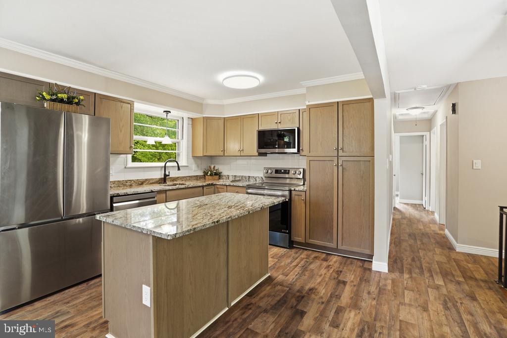 309 Cedar Ridge Drive Oxon Hill, MD 20745 - Photo 23 of 45 Modern kitchen with sleek finishes.