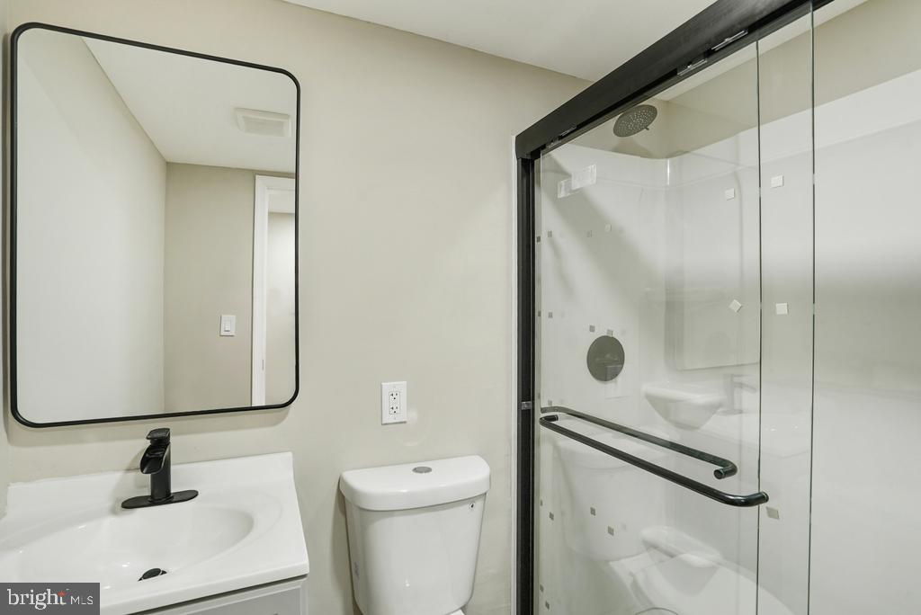 309 Cedar Ridge Drive Oxon Hill, MD 20745 - Photo 28 of 45 Sleek modern bathroom with glass shower.