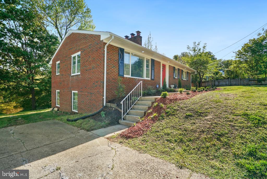 309 Cedar Ridge Drive Oxon Hill, MD 20745 - Photo 3 of 45 Charming brick home with lush surroundings.