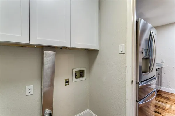 a view of kitchen and cabinets