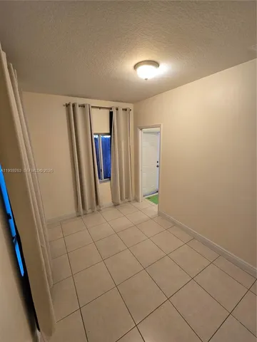 a view of a room and basketball court