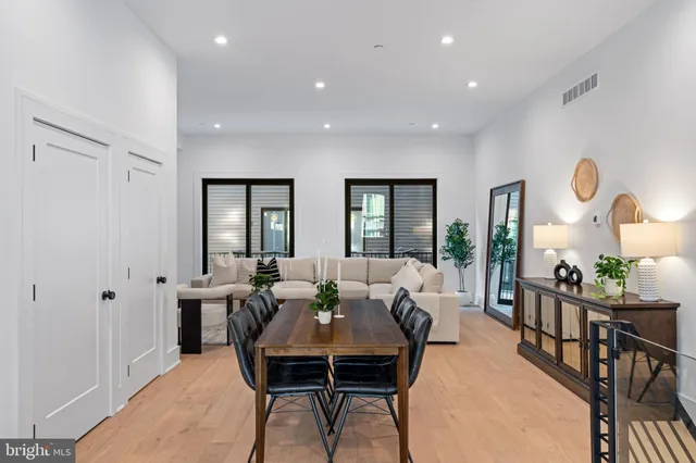 a view of a dining room with furniture window and wooden floor