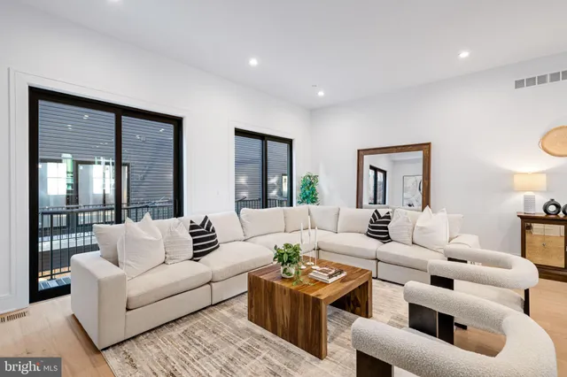 a bathroom with a sink mirror and toilet