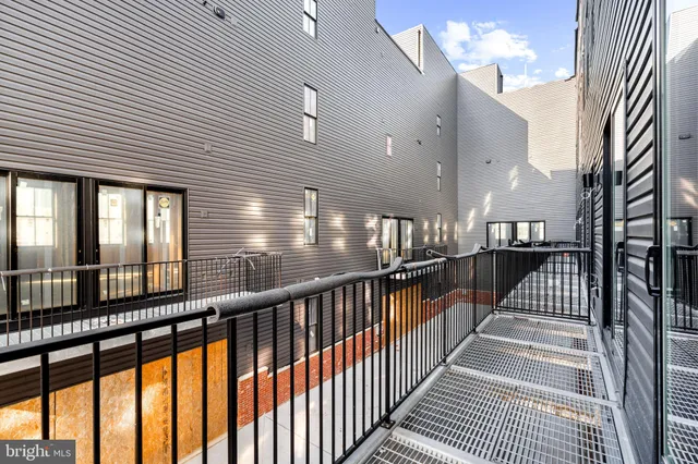 a view of a bedroom with closet and wooden floor