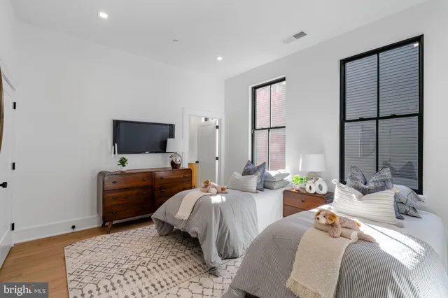 a bedroom with a bed and a couch