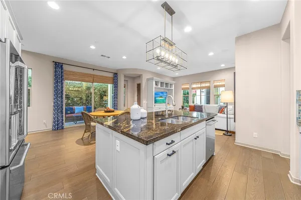a kitchen with stainless steel appliances granite countertop counter space and a sink