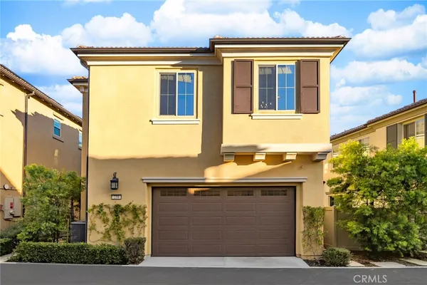 a view of a house with a street