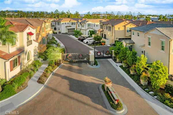 an aerial view of residential houses with outdoor space and swimming pool