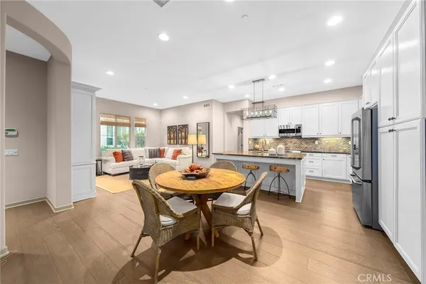 a kitchen with a table and chairs in it