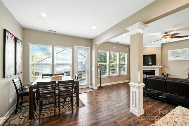 a view of a livingroom with furniture window and wooden floor