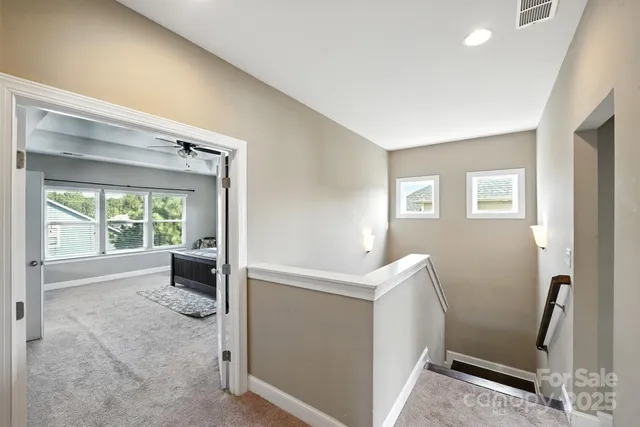 a living room with a bed furniture and a window