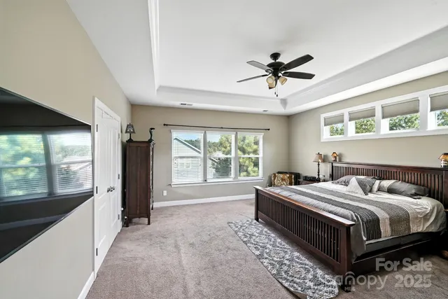 a spacious bathroom with a granite countertop sink and a mirror