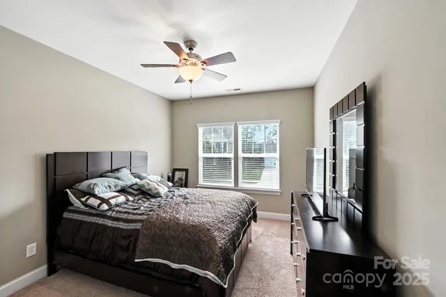 a bathroom with a granite countertop sink mirror and a bathtub