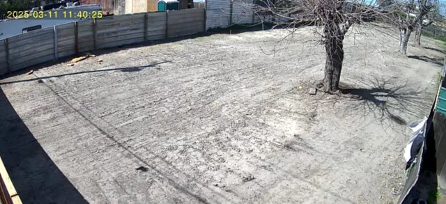 a view of a backyard of the house