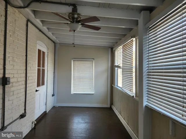 a view of a hallway with a window