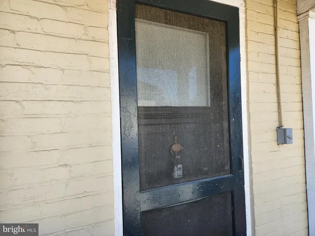 a bathroom with a glass door and shower