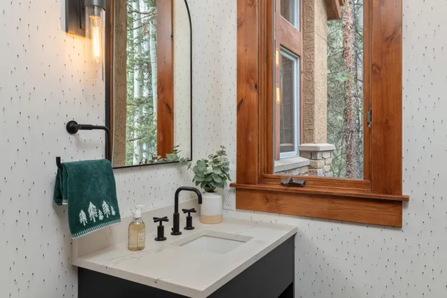 a bathroom with a sink and a mirror