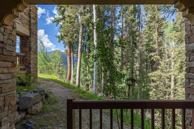 a view of a balcony with wooden floor