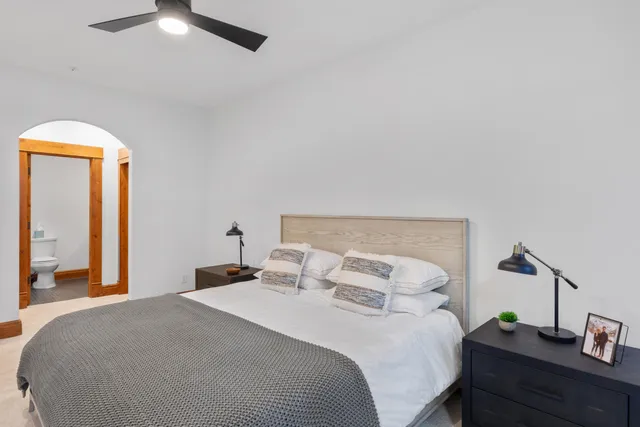 a bedroom with a bed and a couch