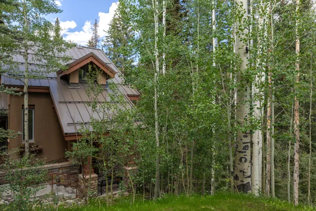 a large building with swimming pool in front of it