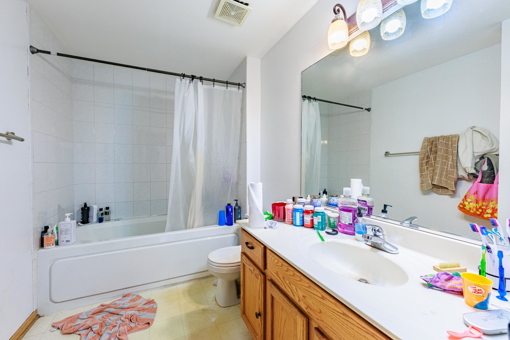 3022 141st Place Blue Island, IL 60406 - Photo 18 of 31 a bathroom with a sink mirror vanity and toilet