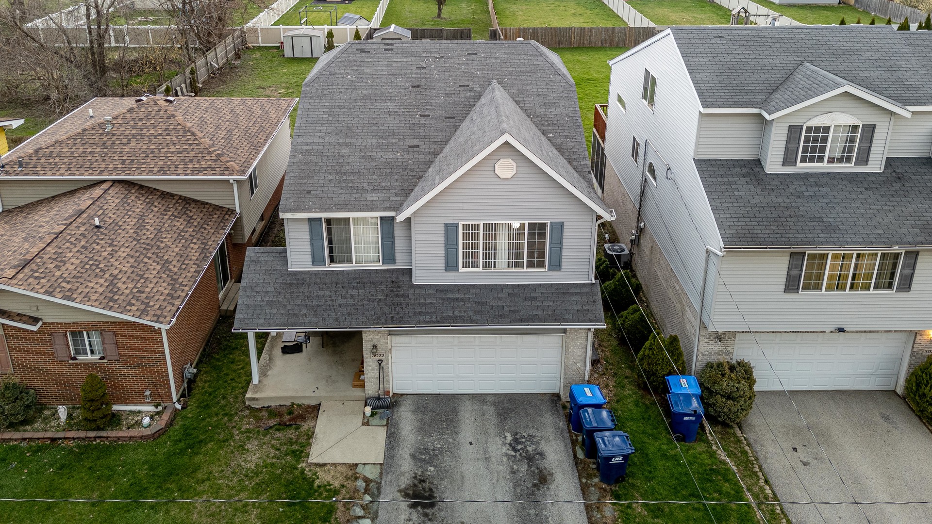 3022 141st Place Blue Island, IL 60406 - Photo 2 of 31 a aerial view of a brick house next to a yard