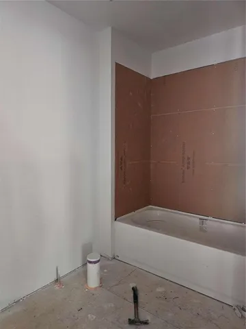 a view of a backyard with a large tree