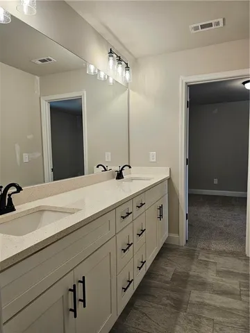 a bathroom with a sink a toilet and a bathtub