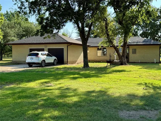a house view with a play ground in front of it