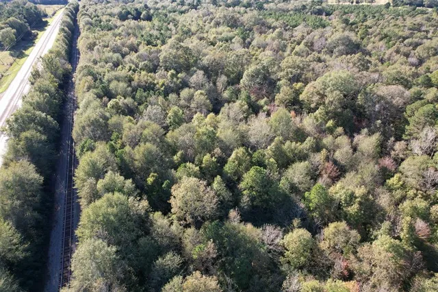an aerial view of house with yard