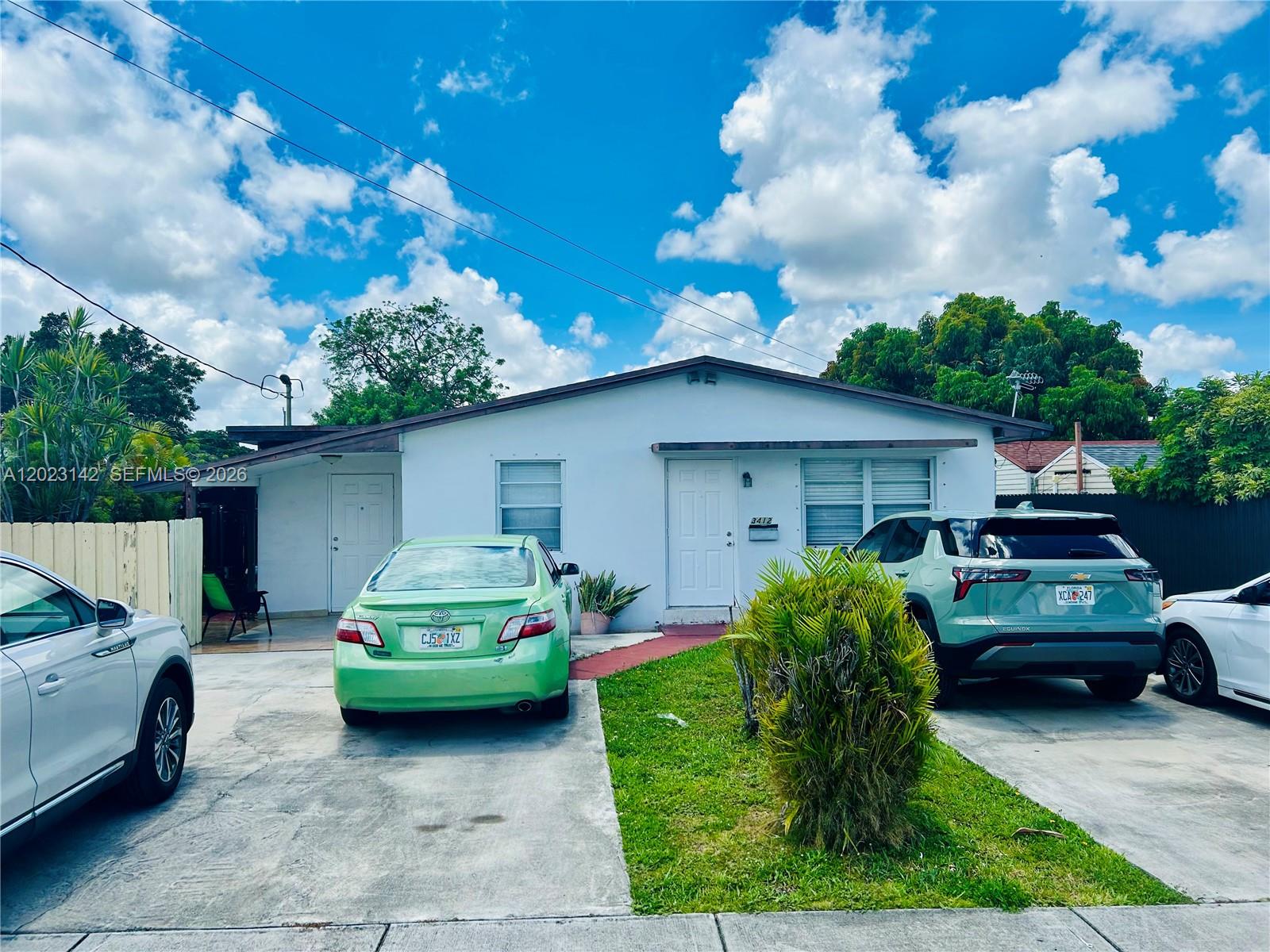 3410 Southwest 89th Court Miami, FL 33165 - Photo 1 of 18 a front view of a house with garden