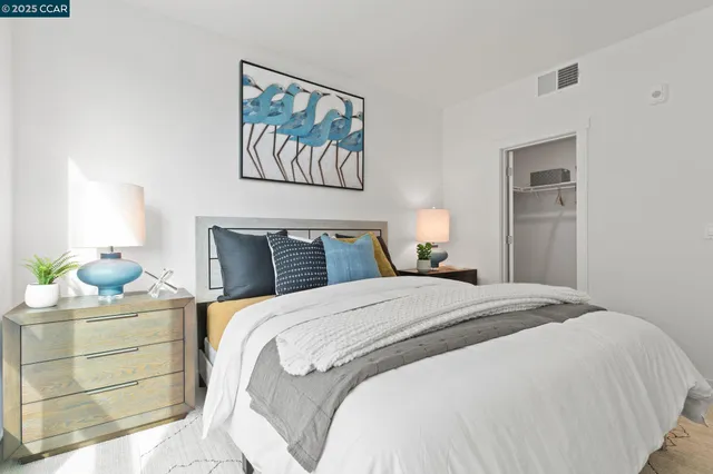 a bedroom with a bed and cupboard