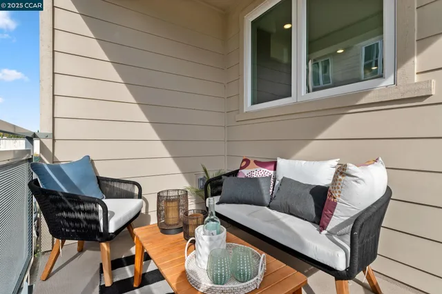 a outdoor living space with furniture and a couch