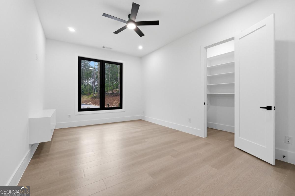 1563 Whitley Road Bethlehem, GA 30620 - Photo 25 of 44 wooden floor in an empty room with a window