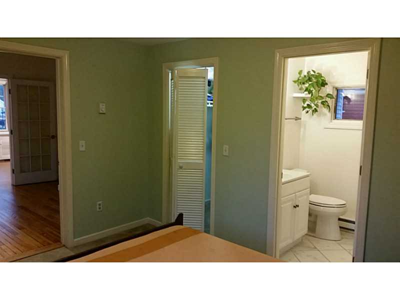 Master Bath/Spa. Looking from across bedroom to walk in closet and full bath with large shower.