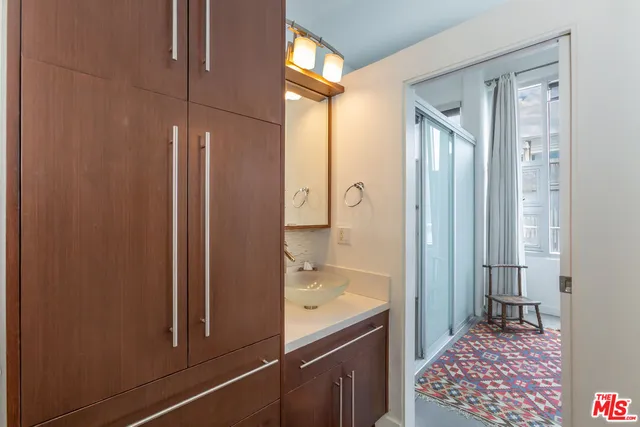 a bathroom with a bathtub and a shower