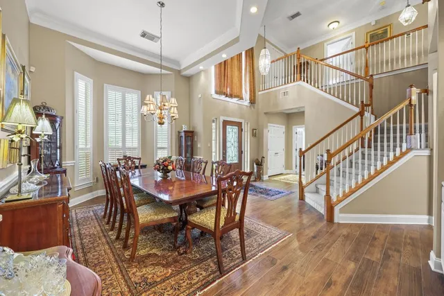 a view of a dining room with furniture window and wooden floor