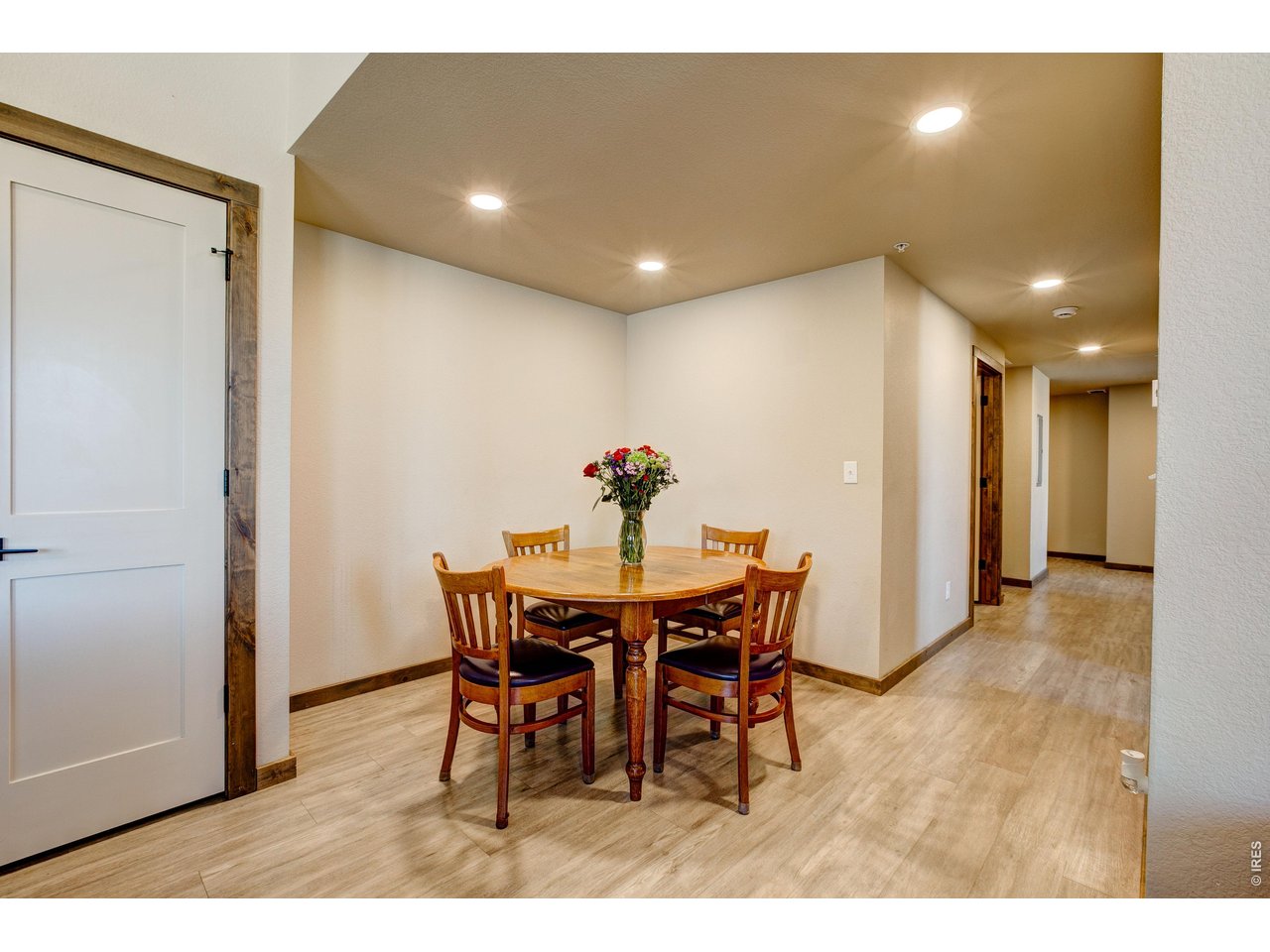 1802 Wildfire Road, Unit 204 Estes Park, CO 80517 - Photo 11 of 37 a view of a dining room with furniture and wooden floor