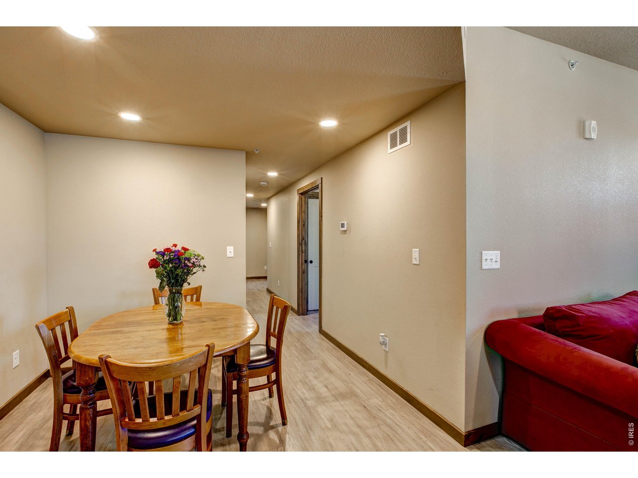 1802 Wildfire Road, Unit 204 Estes Park, CO 80517 - Photo 12 of 37 a dining room with furniture and wooden floor