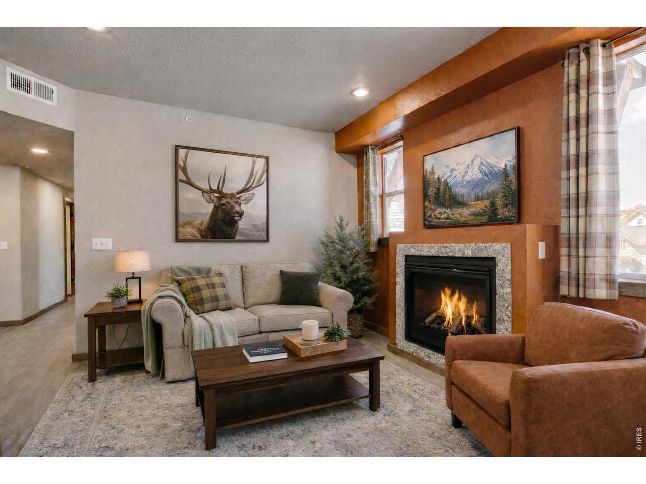 1802 Wildfire Road, Unit 204 Estes Park, CO 80517 - Photo 13 of 35 a living room with furniture and a fireplace