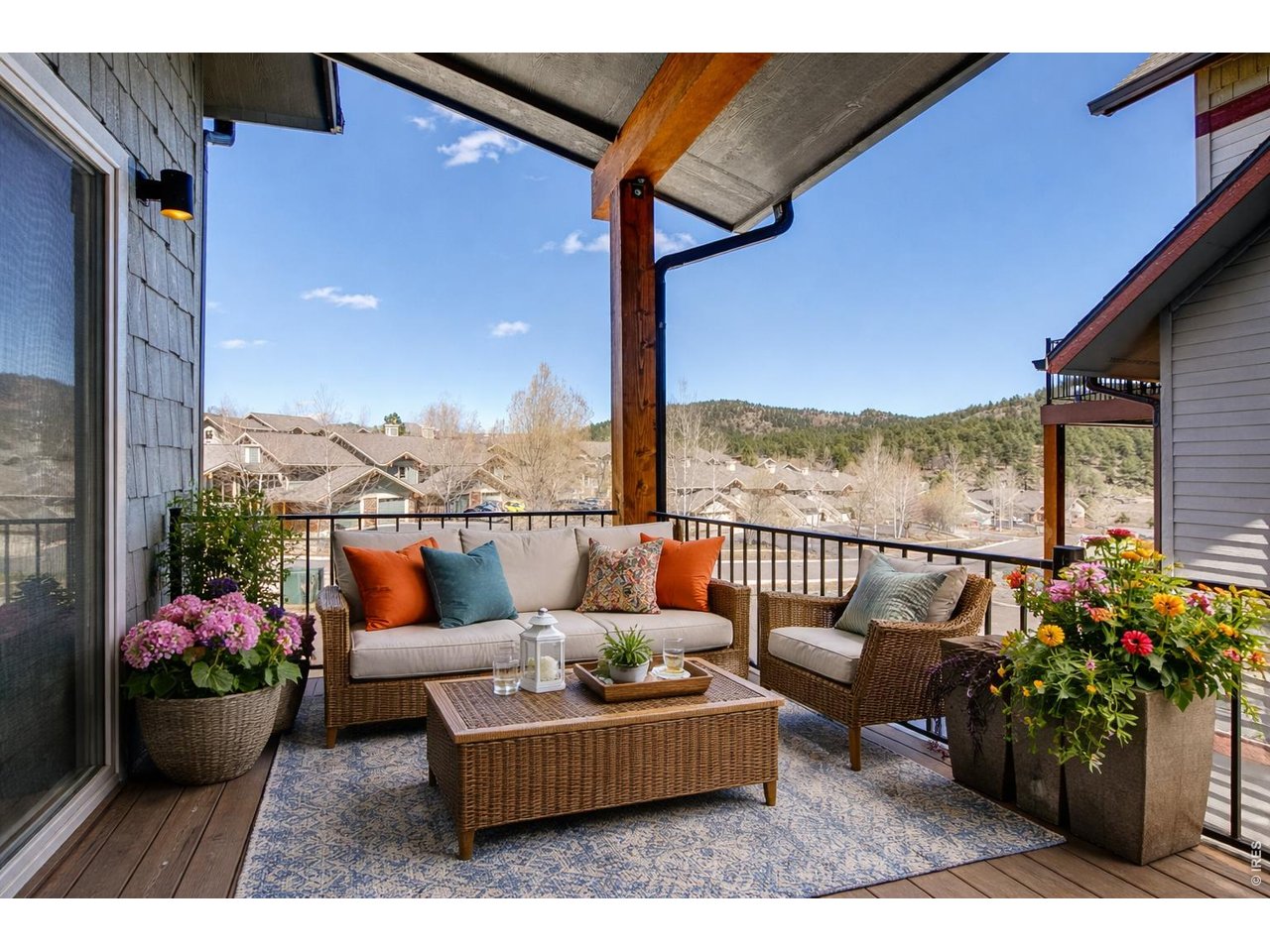 1802 Wildfire Road, Unit 204 Estes Park, CO 80517 - Photo 15 of 35 a view of a couches in the patio with potted plants