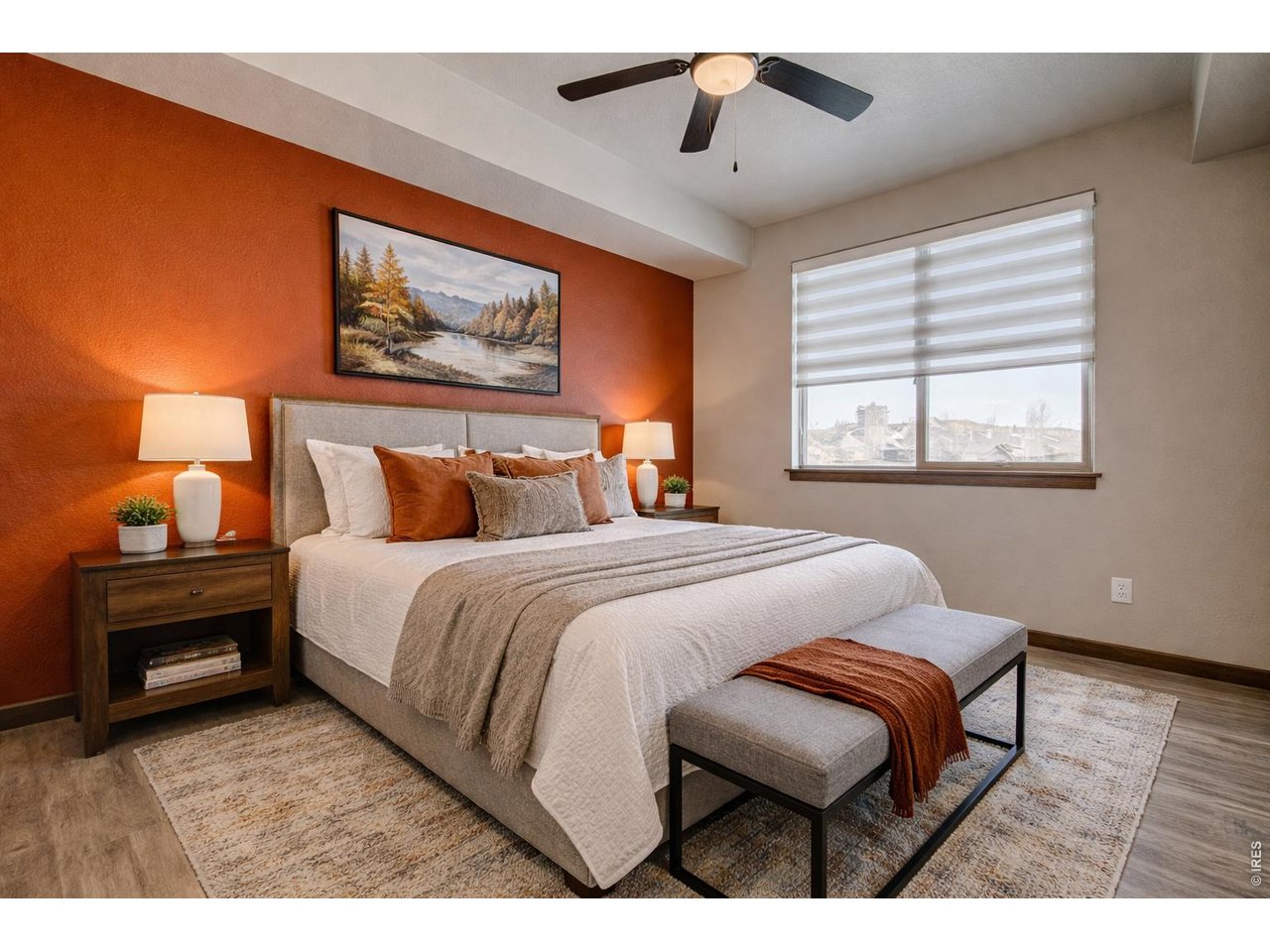 1802 Wildfire Road, Unit 204 Estes Park, CO 80517 - Photo 17 of 35 a bedroom with a bed and a painting on the wall