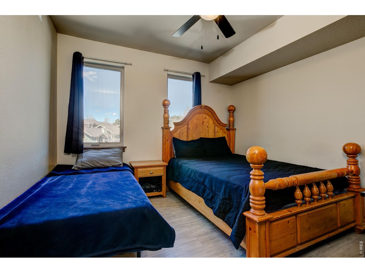 1802 Wildfire Road, Unit 204 Estes Park, CO 80517 - Photo 19 of 37 a bedroom with furniture and wooden floor