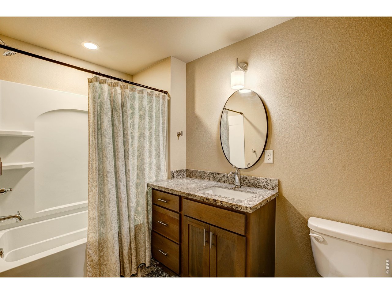 1802 Wildfire Road, Unit 204 Estes Park, CO 80517 - Photo 23 of 37 a bathroom with a mirror sink and a mirror