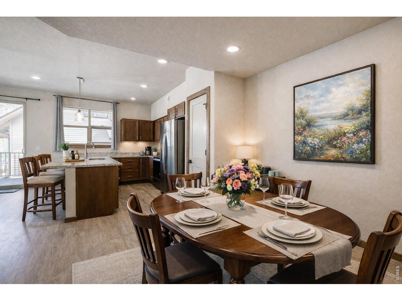 1802 Wildfire Road, Unit 204 Estes Park, CO 80517 - Photo 4 of 35 a view of a dining room with furniture and a livingroom