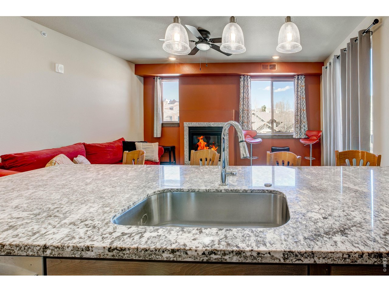 1802 Wildfire Road, Unit 204 Estes Park, CO 80517 - Photo 7 of 37 a bathroom with a granite countertop sink and a mirror