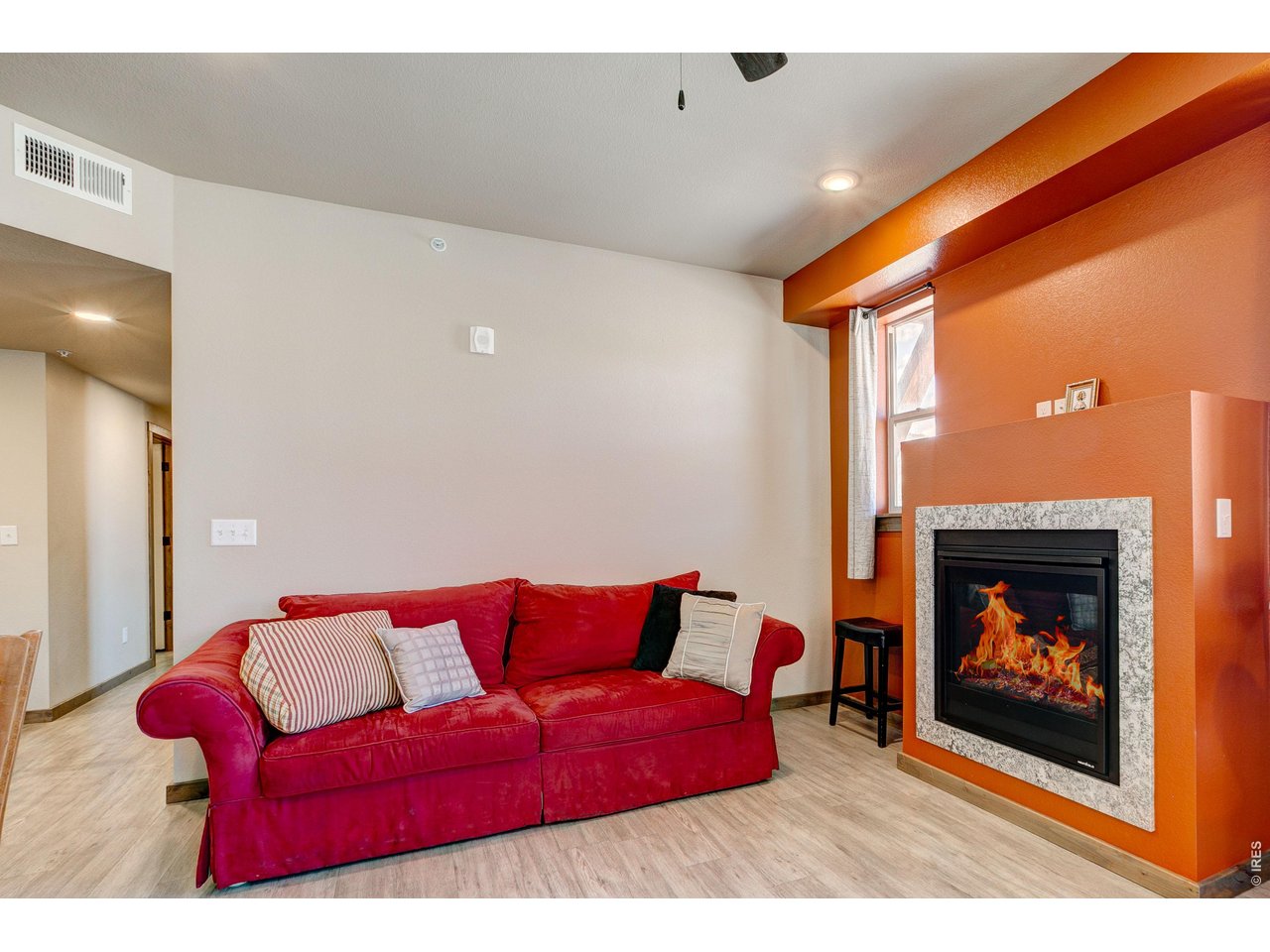 1802 Wildfire Road, Unit 204 Estes Park, CO 80517 - Photo 8 of 37 a living room with furniture a flat screen tv and a fireplace