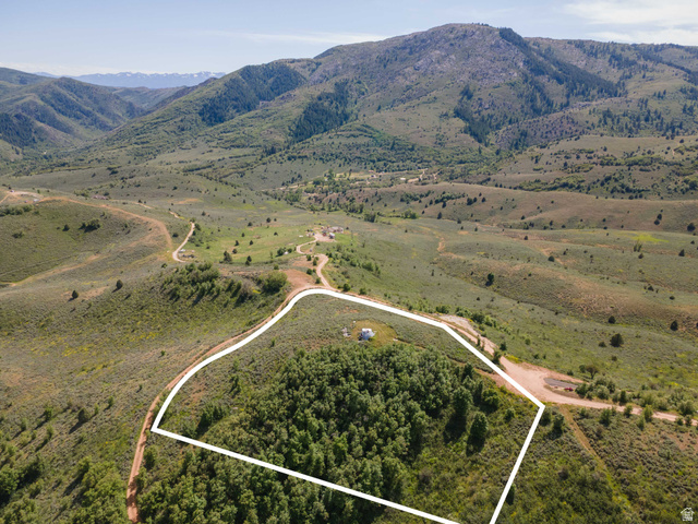 73 North River View Road, Unit 73 Huntsville, UT 84317 - Photo 2 of 21 Expansive mountain landscape with a designated property boundary encompassing a mature tree cluster