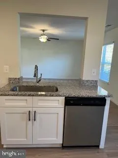 a kitchen with cabinets and appliances