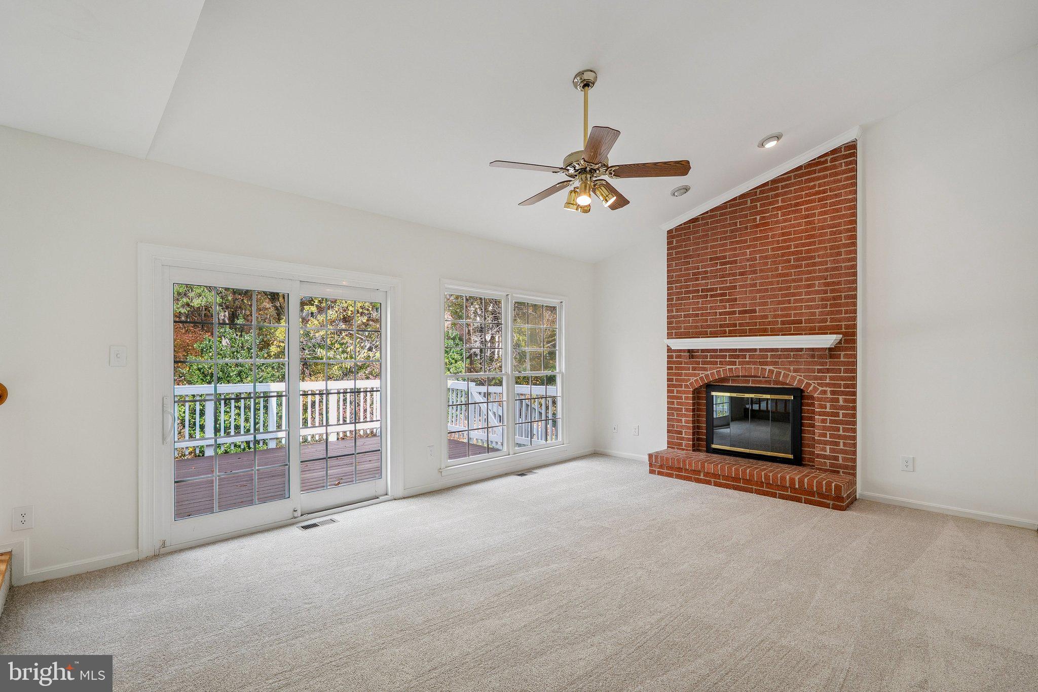 15056 Brown Post Lane Centreville, VA 20121 - Photo 16 of 45 a view of an empty room with a fireplace